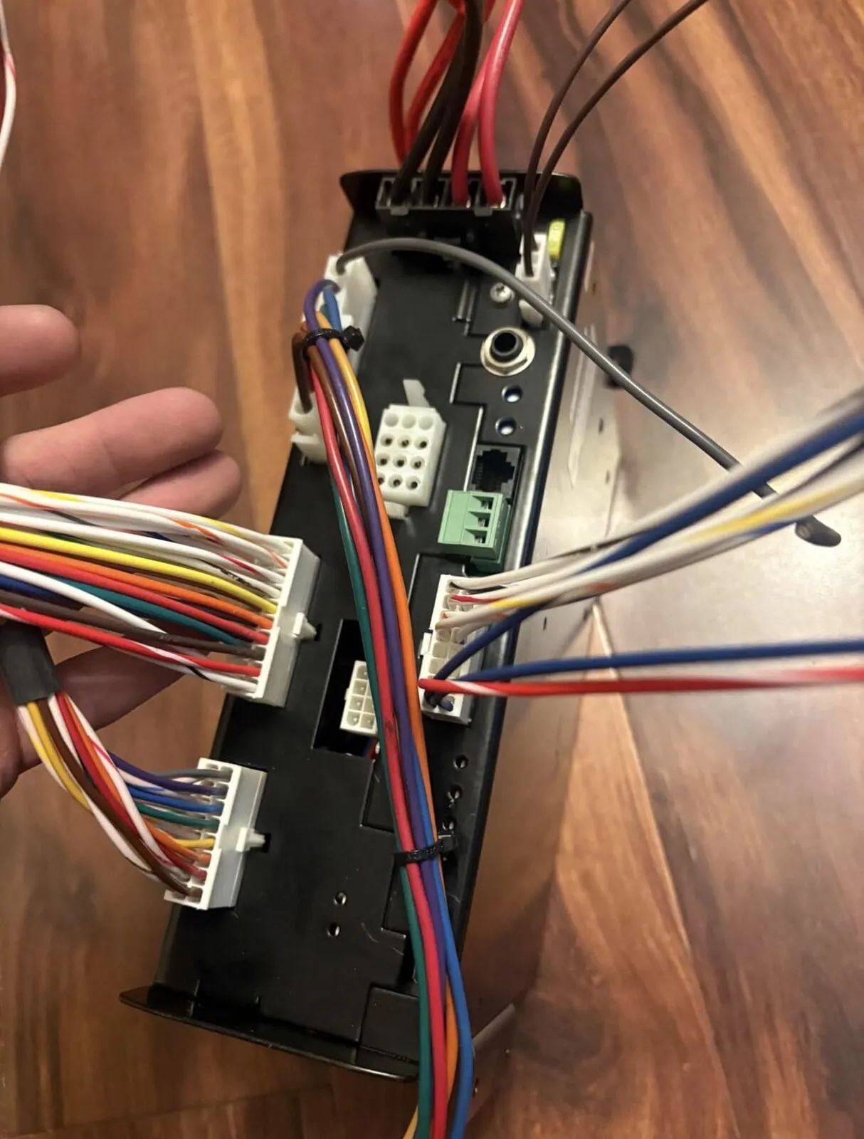 Close view of the module end showing the plugged harness connectors.